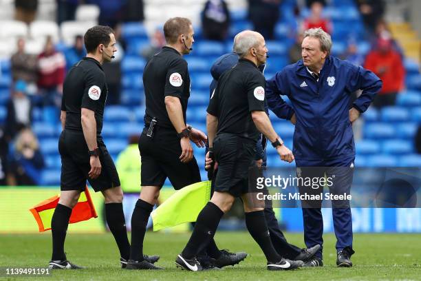 Neil Warnock, Manager of Cardiff City looks at match referee Craig Pawson after the final whistle during the Premier League match between Cardiff...