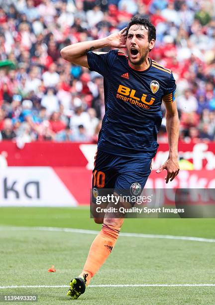 Daniel Parejo of Valencia CF celebrates scoring his team's opening goal with team mates during the La Liga match between Sevilla FC and Valencia CF...