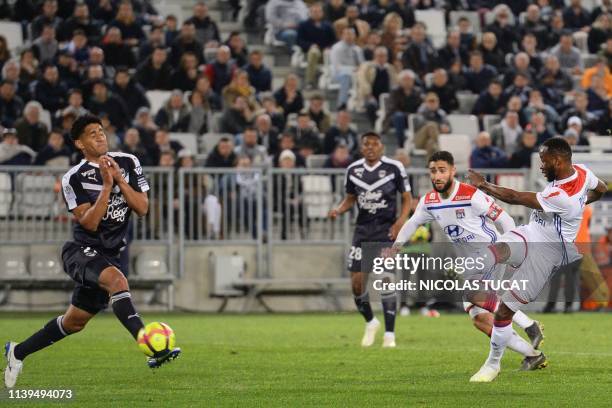 Lyon's French forward Moussa Dembele scores a goal during the French L1 football match between Bordeaux and Lyon on April 26, 2019 at the Matmut...