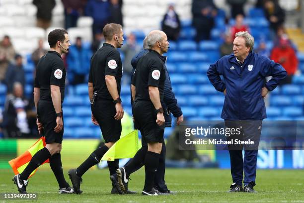Neil Warnock, Manager of Cardiff City looks at match referee Craig Pawson after the final whistle during the Premier League match between Cardiff...