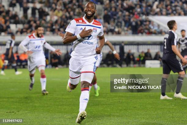 Lyon's French forward Moussa Dembele celebrates after scoring a goal during the French L1 football match between Bordeaux and Lyon on April 26, 2019...