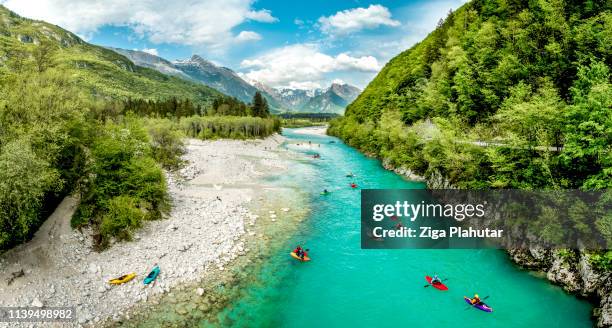 group of people kayaking on the river soča in slovenia europe - kayaking rapids stock pictures, royalty-free photos & images