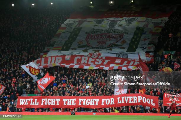 Liverpool fans in The Kop display flags and banners before the Premier League match between Liverpool and Huddersfield Town at Anfield on April 26,...