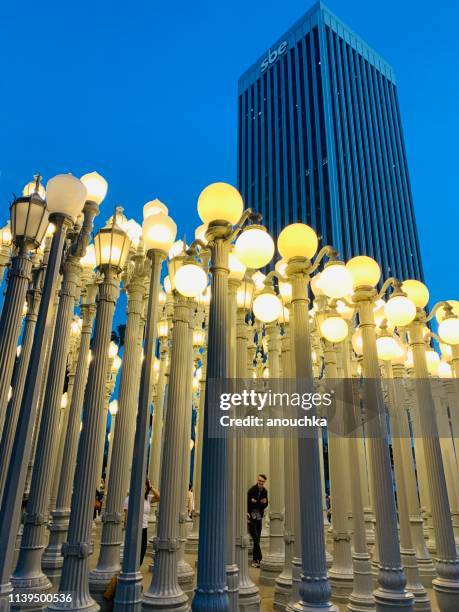 tourists making selfies in front of urban light installation, los angeles, usa - lacma 2019 stock pictures, royalty-free photos & images