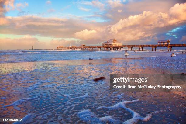 sunrise reflected on clearwater beach florida - tampa stock pictures, royalty-free photos & images