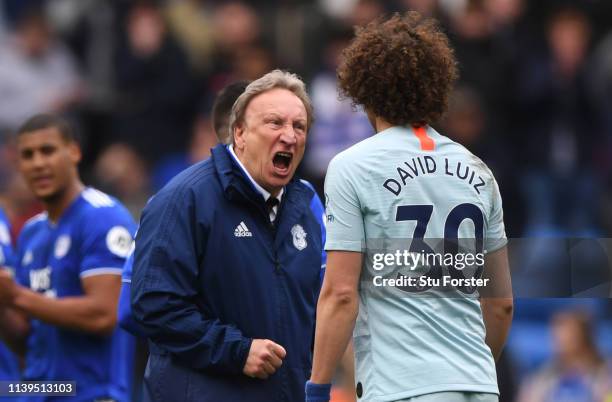 Cardiff manager Neil Warnock has words with Chelsea player David Luiz after the Premier League match between Cardiff City and Chelsea FC at Cardiff...