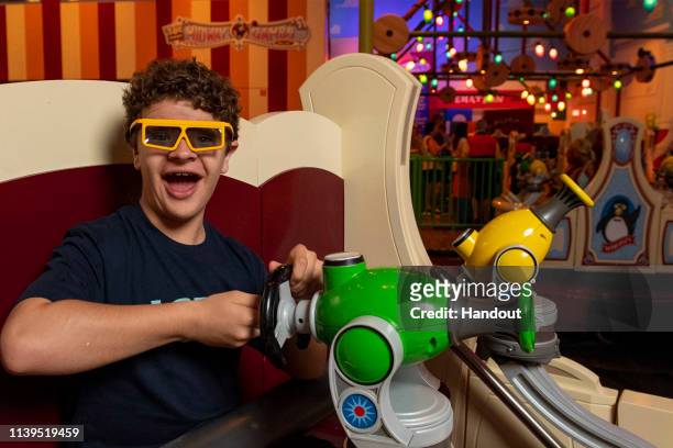 In this handout photo provided by Disney Parks, actor Gaten Matarazzo visits Toy Story Land at Walt Disney World Resort on Friday, April 26, 2019 in...