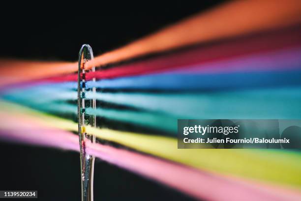 needle of sewing and its colored threads - sewing needle stock pictures, royalty-free photos & images
