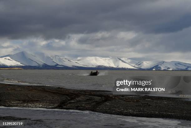 Hunters return from a trip along the coast of the Bering Sea near the climate change affected Yupik Eskimo village of Quinhagak on the Yukon Delta in...