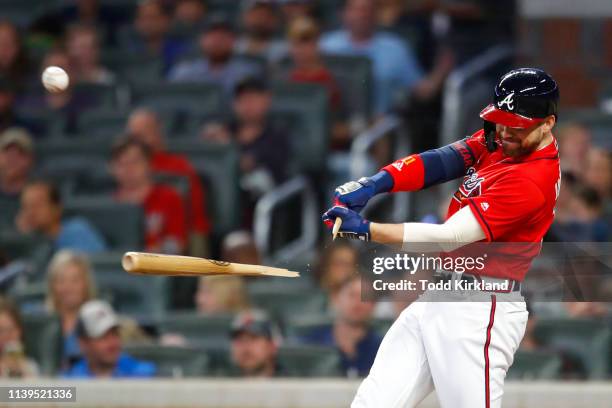 Ender Inciarte of the Atlanta Braves breaks his bat as he hits a single in the fourth inning of an MLB game against the Colorado Rockies at SunTrust...