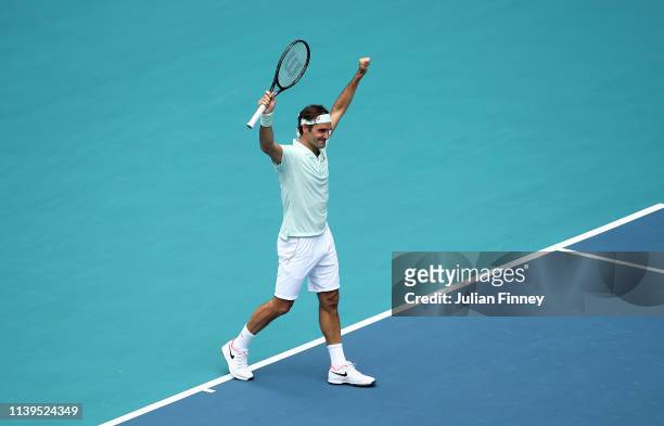 Roger Federer of Switzerland celebrates at match point against John Isner of USA in the final during day fourteen of the Miami Open tennis on March...