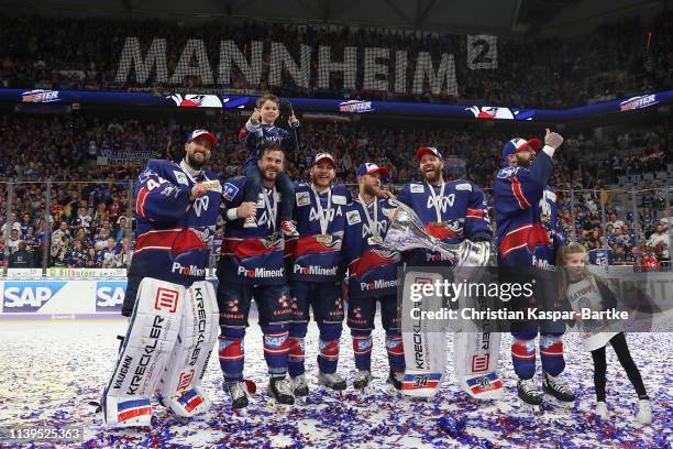 Dennis Endras of Adler Mannheim and Chet Pickard of Adler Mannheim pose after the fifth game of the DEL Play-Offs Final between Adler Mannheim and...