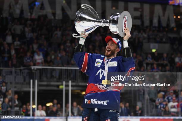 Chad Kolarik of Adler Mannheim celebrates with trophy after the fifth game of the DEL Play-Offs Final between Adler Mannheim and EHC Red Bull...
