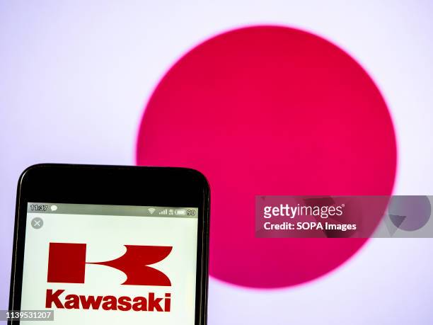 In this photo illustration a Kawasaki Heavy Industries Ltd logo seen displayed on a smartphone.