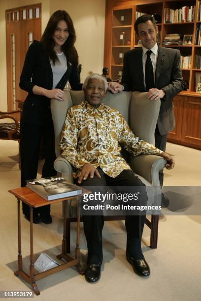 French President Nicolas Sarkozy and his new wife Carla Bruni pose with former South Africa President Nelson Mendela and his wife Graca Machel in...