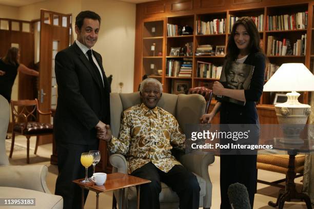 French President Nicolas Sarkozy and his new wife Carla Bruni pose with former South Africa President Nelson Mendela and his wife Graca Machel in...