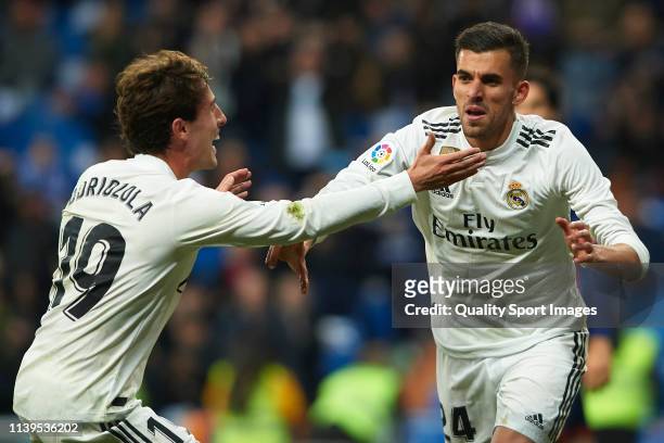 Dani Ceballos of Real Madrid celebrates after scoring his team's second goal with his teammate Alvaro Odriozola during the La Liga match between Real...