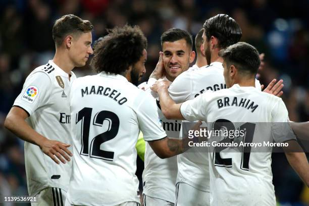 Dani Ceballos of Real Madrid celebrates with team mates after scoring his sides second goal during the La Liga match between Real Madrid CF and SD...