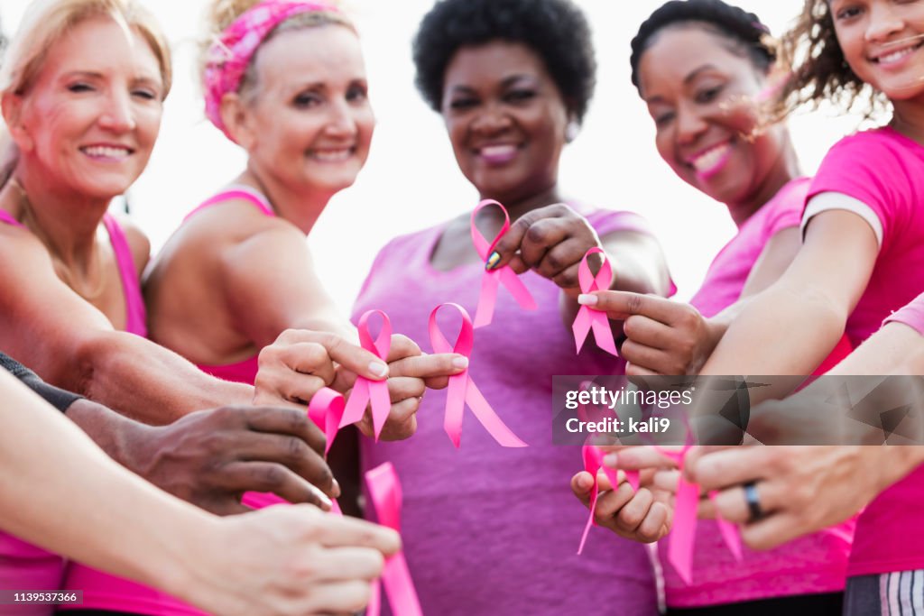 Group of women in pink, breast cancer awareness ribbons