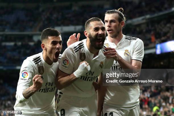 Karim Benzema of Real Madrid celebrates with Dani Ceballos and Gareth Bale after scoring his sides third goal during the La Liga match between Real...