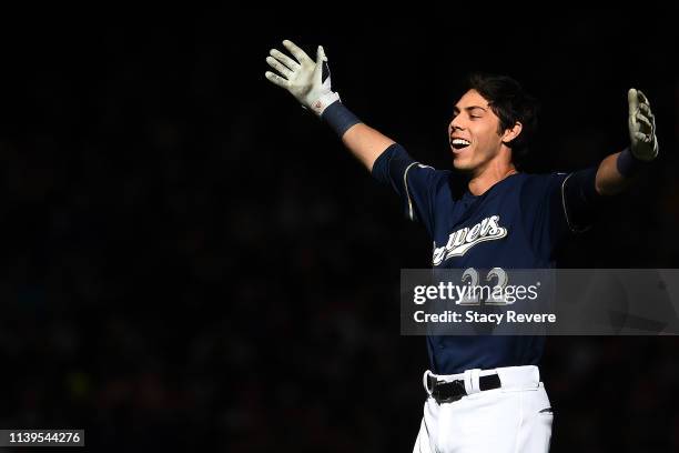 Christian Yelich of the Milwaukee Brewers celebrates after driving in the game winning runs against the St. Louis Cardinals at Miller Park on March...