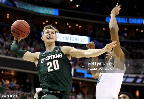Matt McQuaid of the Michigan State Spartans dunks the ball against the Duke Blue Devils during the first half in the East Regional game of the 2019...