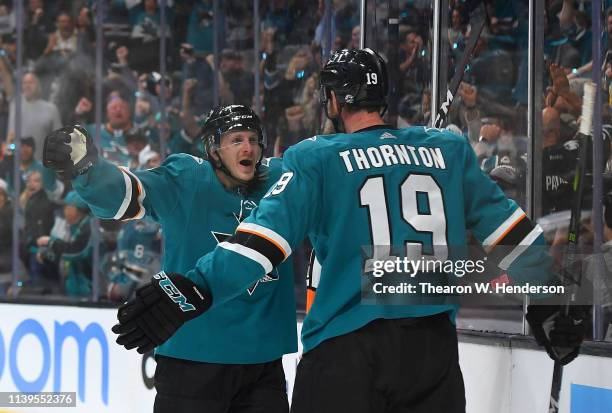 Joe Thornton of the San Jose Sharks is congratulated by Marcus Sorensen after Thornton scored a goal against the Colorado Avalanche during the second...