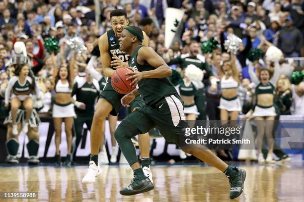 Cassius Winston of the Michigan State Spartans celebrates after his teams 68-67 win over the Duke Blue Devils in the East Regional game of the 2019...