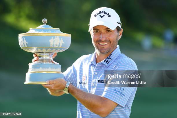 Kevin Kisner of the United States celebrates with the Walter Hagen Cup after defeating Matt Kuchar of the United States 3&2 during the final round of...