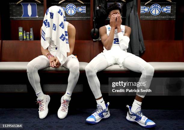 Tre Jones and Cam Reddish of the Duke Blue Devils react in the locker room after their teams 68-67 loss to the Michigan State Spartans in the East...