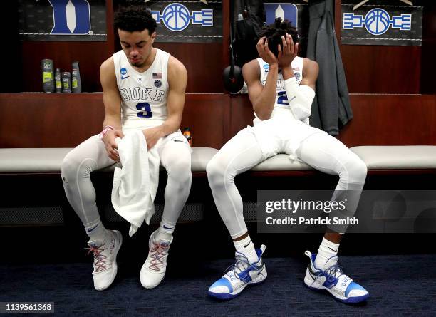 Tre Jones and Cam Reddish of the Duke Blue Devils react in the locker room after their teams 68-67 loss to the Michigan State Spartans in the East...