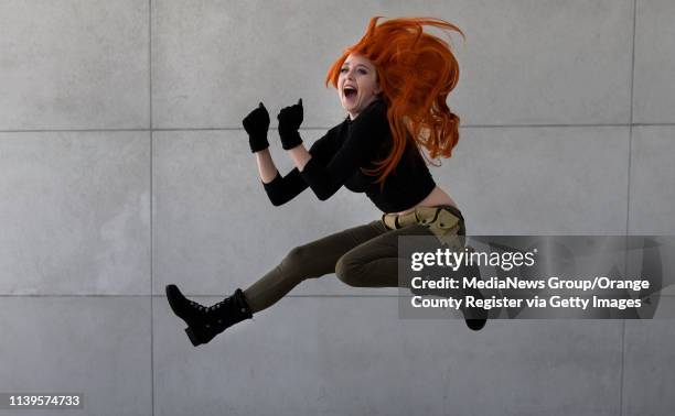 The Incredibles movie character, "Kim Possible," is brought to life by Jessica Lewis at WonderCon in Anaheim on Sunday, March 31, 2019.