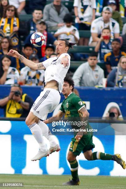 Zlatan Ibrahimovic of the Los Angeles Galaxy jumps to settle the ball during a game against the Portland Timbers at Dignity Health Sports Park on...