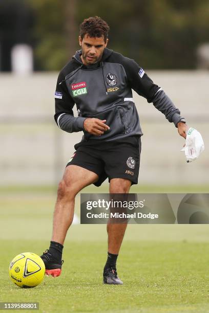 Daniel Wells kicks a soccer ball during a Collingwood Magpies AFL training session at the Holden Centre on April 01, 2019 in Melbourne, Australia.