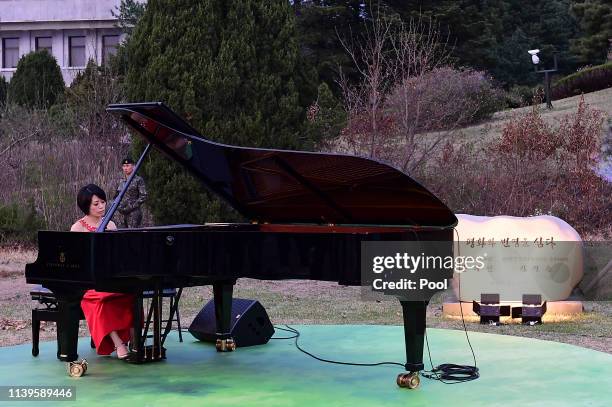 Japanese pianist Ayako Uehara perform during a ceremony to mark the first anniversary of Panmunjom declaration between South Korean President Moon...