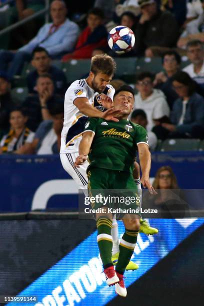 Jorgen Skjelvik of Los Angeles Galaxy and Jorge Moreira of Portland Timbers fight for a header during the second half at Dignity Health Sports Park...