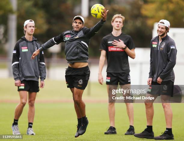 Daniel Wells plays with a soccer ball during a Collingwood Magpies AFL training session at the Holden Centre on April 01, 2019 in Melbourne,...