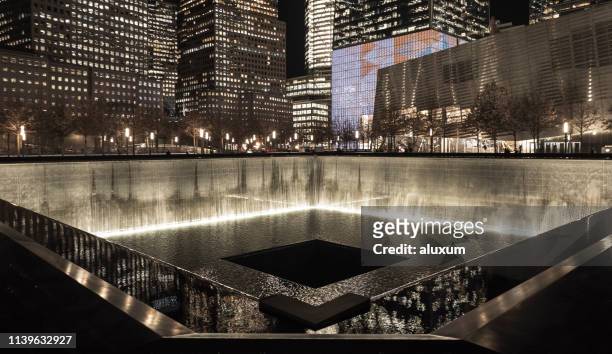 new york city united states of america january 21th 2019 : the national september 11 memorial & museum. this memorial of the 9/11 terrorist attacks is located where the twin towers stand in the past. - national 9 11 memorial museum stock pictures, royalty-free photos & images
