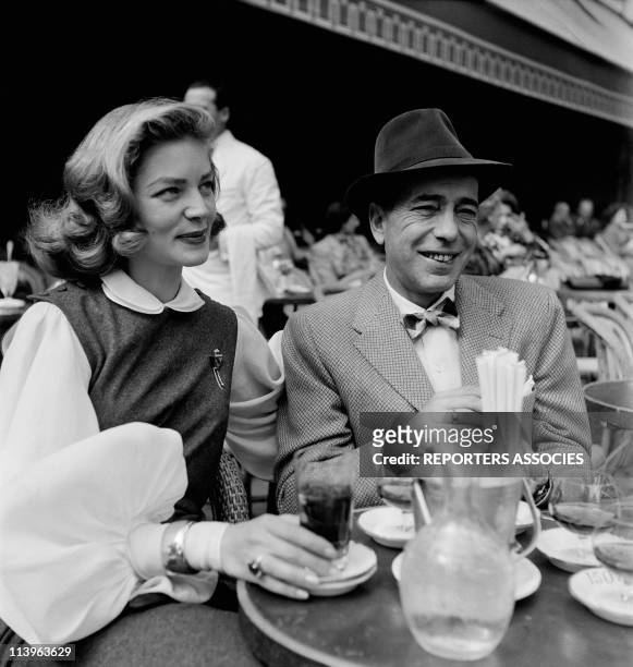 Actors Humphrey Bogart and Lauren Bacall in a Cafe In Paris, France In 1950- American actors Humphrey Bogart and Lauren Bacall have a drink at the...