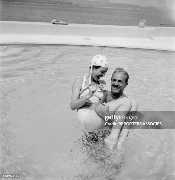 Designer Raymond Loewy on holiday in Southern France with wife Viola In Saint Tropez, France In 1960-With young wife Viola in their pool.