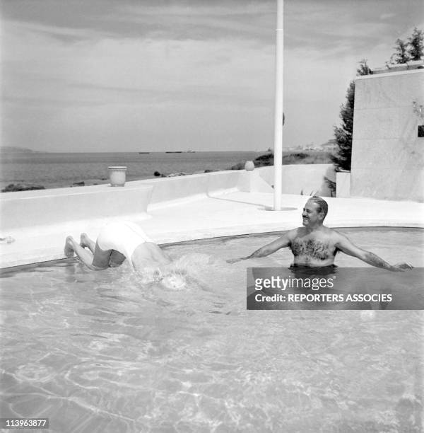 Designer Raymond Loewy on holiday in Southern France with wife Viola In Saint Tropez, France In 1960-With young wife Viola in their pool.