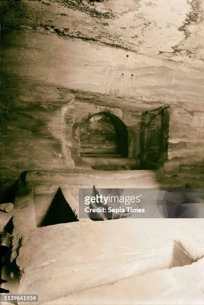 Petra . Lower Siq. Tomb interior in lower Siq. Floor graves and loculi. 1920, Jordan, Petra