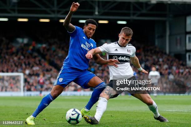 Cardiff City's English midfielder Nathaniel Mendez-Laing vies with Fulham's English defender Joe Bryan during the English Premier League football...