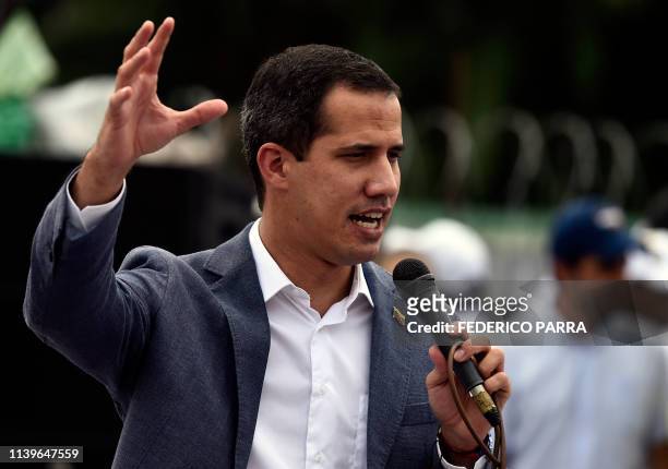 Venezuelan opposition leader and self-proclaimed acting president Juan Guaido addresses supporters during a rally, as part of the "Operation...