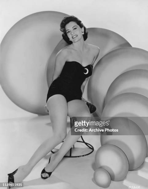 American actress and dancer Cyd Charisse wearing a one-piece swimsuit, circa 1950.