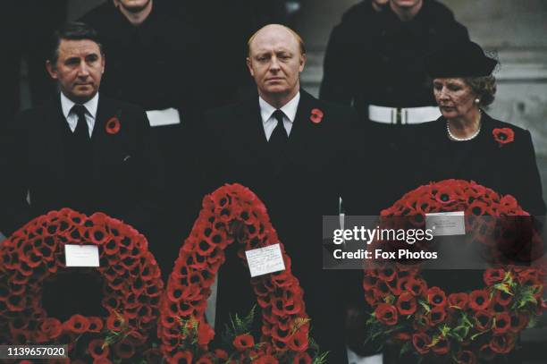 From left to right, Liberal Party leader David Steel, Labour Party leader Neil Kinnock and Prime Minister Margaret Thatcher place wreaths on the...