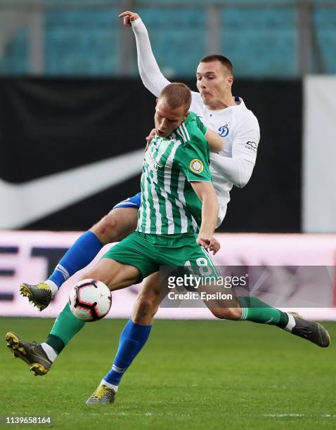 Tony Sunic of FC Dinamo Moscow and Bekim Balaj of FC Akhmat Grozny vie for the ball during the Russian Premier League match between FC Dinamo Moscow...