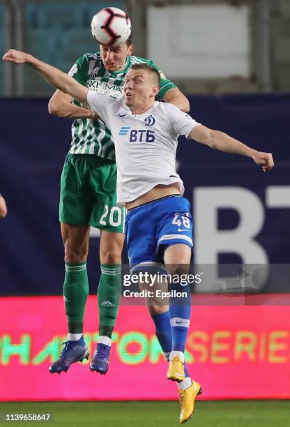 Evgeniy Lutsenko of FC Dinamo Moscow and Zoran Nizic of FC Akhmat Grozny vie for the ball during the Russian Premier League match between FC Dinamo...