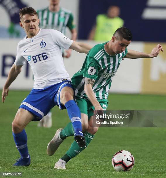Fedor Chernykh of FC Dinamo Moscow and Odise Roshi of FC Akhmat Grozny vie for the ball during the Russian Premier League match between FC Dinamo...