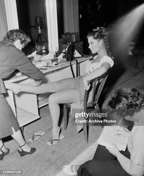 American actress, singer and dancer Mitzi Gaynor in her dressing room during the filming of the musical 'Bloodhounds of Broadway', 1952.